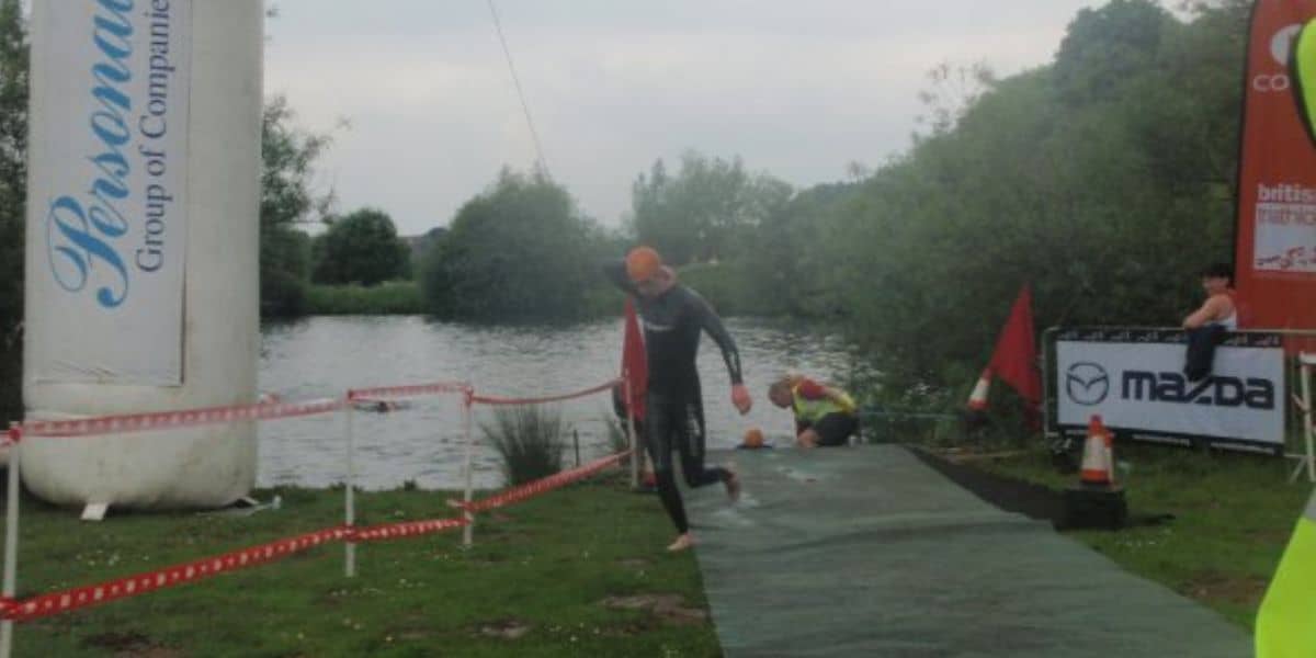 Triathlete getting out of the water