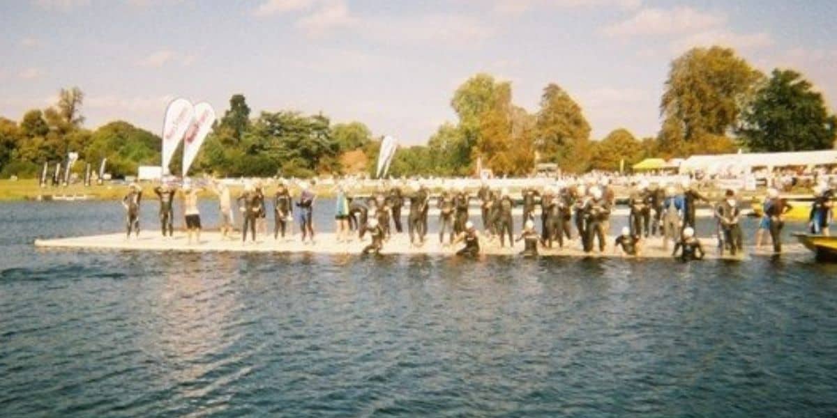 Swimmers ready to get in the water for a triathlon